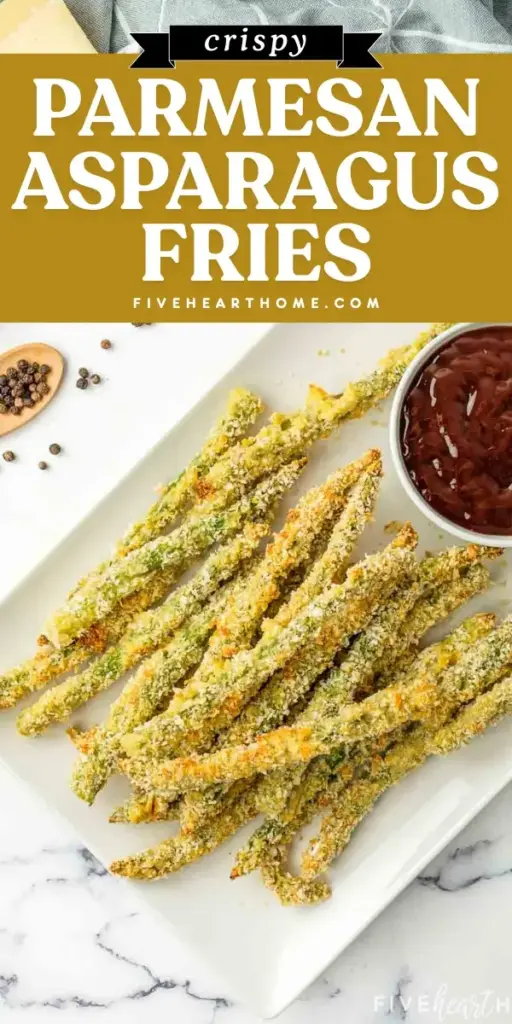A batch of crispy Baked Asparagus Fries arranged on a white ceramic plate, showing a golden panko parmesan crust and charred tips.