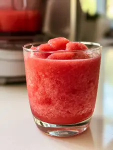 Micro-crystalline texture of a vibrant blue raspberry slushie. (slushie machine recipes)